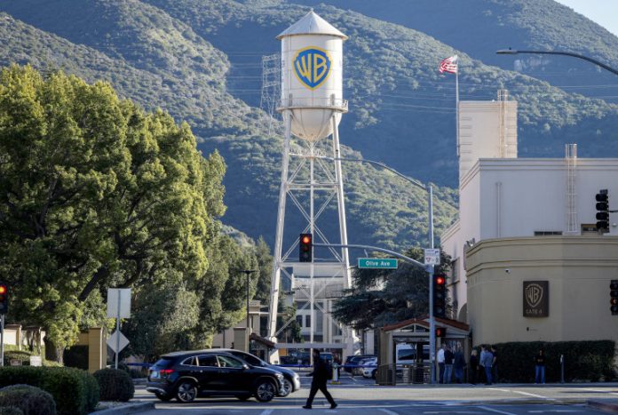 Paramount Skydance has accused Netflix of spearheading a “scorched-earth campaign to try and poison regulators and other stakeholders” against its $110 billion purchase of rival Hollywood studio Warner Bros. Discovery.
In a fiery letter to the Justice Department obtained by NBC News, Paramount Skydance Chief Legal Officer Makan Delrahim excoriated Netflix for what he called a “panic-level response” to the merger that illustrates “just how seriously Netflix takes Paramount as a scaled competitor.”
Paramount’s letter was sent to the Justice Department on Friday and first reported by Politico.
In response to a request for comment, a Netflix spokesperson said that “these claims from Paramount Skydance are absurd.”
“We walked away from this deal months ago and remain focused on our own business, not theirs,” the spokesperson added. “Ultimately, it’s up to the regulators to approve this deal and determine if it is in the best interest of the industry and all concerned.”
In the bidding war for Warner Bros. Discovery, Paramount Skydance triumphed over Netflix in late February. WBD shareholders approved the tie-up in late April.
Trump administration regulators are still reviewing the merger, which would unite two historic Hollywood studios and popular streaming platforms under the same corporate roof, reshaping the American entertainment industry.
The Justice Department did not immediately respond to a request for comment Tuesday.
The water tower at Warner Bros. Studios in Burbank, Calif.Mario Tama / Getty Images file
Delrahim’s letter came in direct response to a March report sent to the Justice Department by the International Brotherhood of Teamsters, a labor union whose members, including drivers, work on film and television sets.
The Teamsters argued that Paramount’s acquisition of WBD “poses a direct threat” to workers. The union called on the Justice Department to block the deal unless “substantial and enforceable safeguards are put in place to increase domestic production and protect jobs.”
Delrahim’s letter flatly rejects that argument, with the legal executive writing that “organized labor will directly benefit from the new competitive energy and increased content investment that the combined firm will bring to the entertainment industry.”
The Teamsters did not immediately respond to a request for comment Tuesday.
Paramount’s letter accuses Netflix of launching a “broader proxy war” that includes trying to “persuade the Teamsters and other stakeholders that Disney’s acquisition of Fox had a negative impact on content production and labor opportunities.”
“Frankly,” Delrahim added, “Netflix’s ‘sky is falling’ narrative departs significantly from the ground-truth reality of what actually happened.”
The Walt Disney Co. took over 21st Century Fox’s entertainment assets in a $71.3 billion deal that closed in 2019.
Delrahim forcefully pushed back on the Teamsters’ contention that Disney’s takeover of the Fox assets hurt workers, writing in part that the Mouse House “unequivocally increased its spending on producing content overall since acquiring Fox.”
“Respectfully,” Delrahim wrote, “we do not understand why Netflix and its proxies are still pushing the Disney-Fox merger as a cautionary tale for studio combinations.”
The Teamsters is not the only group that has raised concerns about the Paramount-Warner transaction. In recent months, hundreds of A-list Hollywood actors, producers and directors have advocated against the deal.
“This transaction would further consolidate an already concentrated media landscape, reducing competition at a moment when our industries — and the audiences we serve — can least afford it,” more than 1,000 entertainment professionals said in an open letter published in April.
The prospective merger is also facing scrutiny from California Attorney General Rob Bonta, whose office is investigating the deal, and the United Kingdom’s antitrust authority, which formally announced a probe Tuesday.
Paramount Skydance CEO David Ellison has vowed to “honor the legacy of two iconic companies while accelerating our vision of building a next-generation media and entertainment company.” He has also publicly vowed to release at least 30 feature films a year in movie theaters.
Delrahim became Paramount Skydance’s chief legal officer last fall. He was previously the U.S. assistant attorney general for the Antitrust Division during President Donald Trump’s first term in the White House.