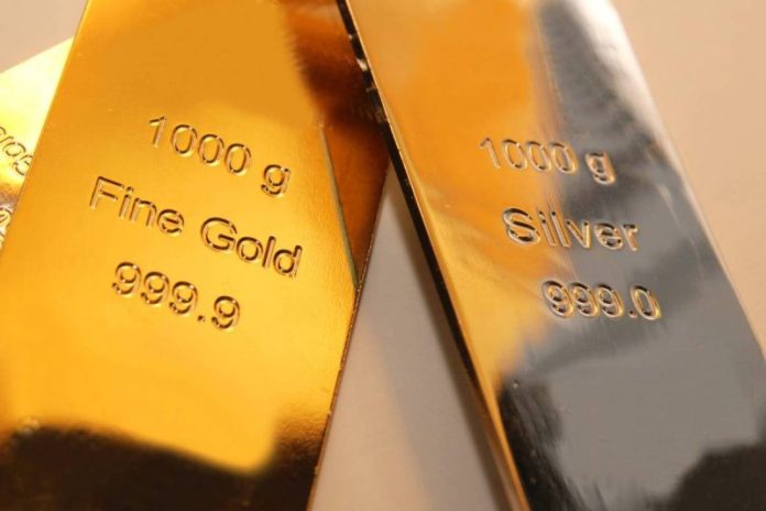 <strong>Precious metals prices continued to face downward pressure this week as investors took strong US economic data and a changing geopolitical landscape into consideration. </strong>
After climbing to fresh all-time highs at the start of 2026, a myriad of factors in February have seemingly taken the sails out gold, silver and platinum prices. However, the underlying fundamentals for the precious metals remain strong, resulting in a resiliency that lends optimism to higher price points to come in 2026.
Let’s take a look at what got spot prices moving over the past week.
Gold price
Gold hit a record high of close to US$5,600 per ounce at the end of January before sliding into one of the largest price drops in decades, dipping as low as US$4,400 as February kicked off.
Over the past week, the metal has oscillated between slumps and cautious recovery. The spot price lost the battle to remain above the key US$5,000 mark in morning trading on February 12, falling to an intraday low of US$4,907.41. February 13 saw gold rebound slightly and trade in a tight range between US$5,000 and US$5,040.
Gold couldn’t hold that level on Monday (February 16), and the next day it began sliding below the US$4,900 support level. Wednesday (February 18) brought some relief, with gold once again fighting to stay above US$5,000.
<em><em>Gold price chart, February 12, 2026 to February 18, 2026.</em></em>
The primary drivers for gold this past week are:
Seasonal liquidity is also at play this week as the Lunar New Year holiday, which runs from February 16 to 23, typically results in lower trading volumes.
In other gold news, the 2026 TSX Venture 50 list was released on Wednesday, with several gold companies named as top performers. The top five gold stocks on the list are: 1911 Gold (TSXV:AUMB,OTCQB:AUMBF), TDG Gold (TSXV:TDG,OTCQX:TDGGF), Omai Gold Mines (TSXV:OMG,OTCQB:OMGGF), Prospector Metals (TSXV:PPP,OTCQB:PMCOF) and Goldgroup Mining (TSXV:GGA,OTCQX:GGAZF).
Silver price
Silver has broadly tracked gold’s price movements over the past week.
However, the white metal has exhibited significantly higher volatility, and the silver spot price is far outside of striking range of its all-time high of more than US$121 per ounce, which it reached on January 29.
Silver fell by more than 9 percent on February 12 as it followed gold on the downtrend, falling from around US$83 to US$75. On Friday the 13th, silver managed not to scare investors as it traded mostly sideways at the US$77 level.
For most of Monday and Tuesday (February 17), silver continued to limp along this trend line, but has managed to gain ground, rising from the US$75 level to an intraday high of US$78.24 as of 11:00 a.m. PST on Wednesday.
<em><em>Silver price chart, February 12, 2026 to February 18, 2026.</em></em>
In addition to the macro factors influencing gold, volatility in the silver market has also come from the ups and downs in the artificial intelligence (AI) sector. Silver, the most electrically and thermally conductive metal on the planet, is considered a key material for AI tech, particularly in data centers and high-performance computing.
Over the past week, the Global X Artificial Intelligence & Technology ETF (NASDAQ:AIQ) has slid from approximately US$50.55 to US$49.94 as of midday on Wednesday, reflecting broader weakness in the sector.
In other silver news, in its latest annual outlook, published on February 10, the Silver Institute reported that it expects macroeconomic and geopolitical conditions to remain broadly supportive for silver in 2026.
Platinum price
On February 12, platinum was trading as high as US$2,136 per ounce in early morning trading, but soon followed its precious metals sisters on a downward slide to an intraday low of US$1,982.50. The metal was back above US$2,070 the next day, and for the first part of this week it’s managed to trade above the US$2,000 level.
Wednesday was a recovery day for platinum as it reached an intraday high of US$2,122.90 as of 11:00 a.m. PST.
<em><em>Platinum price chart, February 12, 2026 to February 18, 2026.</em></em>
Platinum is one of the top-performing metals over the past year, reaching 12 year highs in recent weeks. Demand is being driven by the metal’s essential role in the emerging hydrogen economy. It’s also still seeing robust demand from the auto sector despite the emergence of electric vehicles and uneasy consumer confidence in the economy.
On the supply side, global platinum reserves remain critically low, especially as the world’s biggest producer, South Africa, continues to be plagued by power shortages and operational disruptions.
This week, Johnson Matthey (LSE:JMAT,OTCPL:JMPLF), Sibanye-Stillwater (NYSE:SBSW) and Valterra Platinum (LSE:VALT,JSE:VAL,OTCPL:AGPPF) launched a multimillion-dollar partnership to develop new platinum-group metals clean energy and industrial technologies outside of the auto sector.
Palladium price
Palladium has been the black sheep of the precious metals family for the past few years, remaining well below its March 2022 all-time record of US$3,440.76 per ounce.
On February 12 it followed the precious metals pack down from US$1,741 to as low as US$1,664.
After a rebounding above to US$1,783 level on Monday, the following trading today brought much volatility to the metal, which traded in the US$1,670 to US$1,720 range. Platinum managed to to make gains to the upside on Wednesday with an intraday high of US$1,774 as of 11:00 a.m. PST.
<em><em>Palladium price chart, February 12, 2026 to February 18, 2026.</em></em>
The palladium price is being held down by a slump in demand for electric vehicles and a looming oversupply situation. Analysts at Heraeus Precious Metals predict that the palladium market may move into a surplus in 2026 as secondary supply from recycling increases by 10 percent.
On that note, an announcement shaping the outlook for palladium on the supply side this past week came from the US Department of Commerce, which issued a preliminary statement of support for anti-dumping duties of approximately 133 percent on unwrought Russian palladium imports.
This follows a petition from Sibanye-Stillwater over allegations that Russian metal is being sold in the US at less than fair value. A final decision is expected in the case by June of this year.
<strong>Securities Disclosure: I, Melissa Pistilli, hold no direct investment interest in any company mentioned in this article.</strong>
This post appeared first on investingnews.com