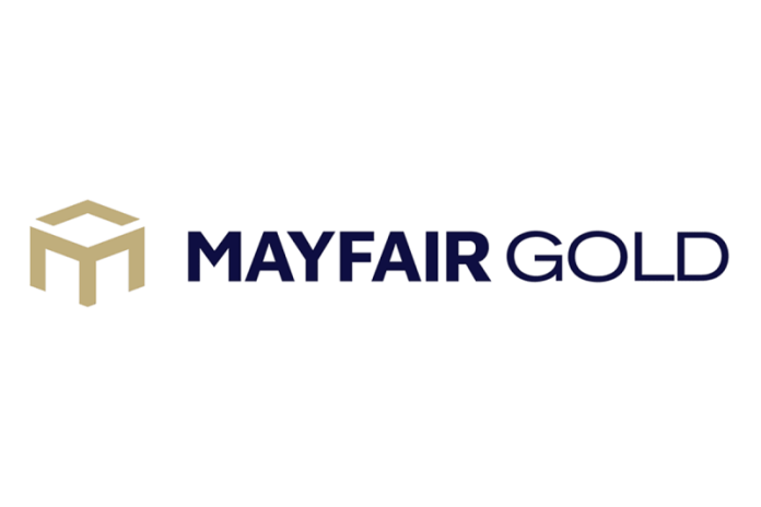 Mayfair Gold Corp. (‘Mayfair’, ‘Mayfair Gold’, or the ‘Company’) (TSXV: MFG,OTC:MFGCF) (NSYE: MINE) is pleased to announce the initial results from the tight-spaced, grade control drilling program (‘Grade Control Program’ or ‘Program’) at the Fenn-Gib Project in Northern Ontario.
Nick Campbell, CEO of Mayfair Gold commented, ‘<i>These initial results increase our confidence in the highest‑grade, early years of the Fenn‑Gib mine. While preliminary, they indicate potential for positive grade reconciliation, support the PFS early‑year assumptions, and are providing important data to advance project financing. Remaining assays are expected in Q1 2026.</i>‘
The Grade Control Program comprised 56 diamond drill holes totaling approximately 4,200 metres. All holes were drilled vertically on a 10 m x 10 m spacing pattern to a target depth of 75 metres. The program was completed within the core of the Phase 1 starter pit and represents roughly one million tonnes of material anticipated to form part of the initial plant feed once construction is complete.
The objective of the program was to simulate grade control drilling and provide additional data to support delineation of the near‑surface portion of the orebody. This news release reports results from 36 of the 56 drill holes; assays for the remaining holes are pending.
These results are considered interim in nature until all data from the complete Program is received and all QAQC results have been verified. No conclusions are being drawn currently regarding potential impacts on the overall mineral resource estimate or mine plan. In addition, the drill results disclosed herein were not incorporated into the Company’s 2026 Pre-Feasibility Study, published on 8 January 2026 and titled <i>‘Fenn-Gib Project: NI 43101 Technical Report and Pre-Feasibility Study.’</i> A copy of the technical report is available under the Company’s profile on SEDAR+.
According to Jean-Francois Metail, Mayfair’s Mineral Resource consultant, ‘<i>In these interim results, the grade control program is already providing a high level of confidence in the block model within the starter pit. Just as importantly, it is generating critical, mining‑scale information on ore geometry, dilution, and potential ore loss that will be hugely useful as the operation moves toward start‑up and early production.</i>‘
The objectives of the Grade Control Program were to:
Validate near‑surface grade distribution and ore geometry using closely spaced grade‑control drilling
Compare drilling results directly against the existing resource block model to assess local grade variability
Improve definition of ore–waste boundaries to support efficient mining (i.e., reduce dilution and metal‑loss in both planning and operations)
Increase confidence in grades and production during the ramp-up and early years of operations
Contribute to broader strategy of de‑risking the Project following the PFS
Enhance confidence for potential lenders as part of the Fenn-Gib project financing
The following figures illustrate the general location of the Program within the initial starter pit
<b>(Interim) Grade Control Program Drill Data </b>
The data presented provides a direct comparison between the intervals drilled during the Grade Control Program and those predicted by the current mineral resource block model.
Figure 1: Comparison of Grade Control and Block Model Results
(1)
(2)
(3)
(4)
(5)
<b>Hole-ID</b>
<b>Grade Control Program</b>
<b>Block Model</b>
<b>Grade Control Program</b>
<b>Block Model</b>
<b>Total Length (m)</b>
<b>Au Capped (g/t)</b>
<b>Au (g/t)</b>
<b>Length</b>
<b>(m)</b>
<b>Au </b>
<b>Capped (g/t)</b>
<b>Length</b>
<b>(m)</b>
<b>Au </b>
<b>(g/t)</b>
<b>Au > 0.0 g/t</b>
<b>Au >= 0.80</b>
MRE-FG25-001
63
0.93
1.14
24
1.78
39
1.53
MRE-FG25-002
70
1.42
1.23
37
2.21
52
1.49
MRE-FG25-003
64
1.54
1.07
43
2.06
41
1.35
MRE-FG25-004
66
1.02
1.18
41
1.42
41
1.65
MRE-FG25-005
64
1.17
2.22
35
2.06
51
2.63
MRE-FG25-006
64
0.92
1.23
15
2.22
46
1.58
MRE-FG25-007
63
0.99
1.51
31
1.47
46
1.93
MRE-FG25-008
62
0.90
0.95
11
2.78
36
1.24
MRE-FG25-009
63
0.89
1.00
31
1.32
36
1.45
MRE-FG25-010
66
1.08
1.14
31
1.86
41
1.52
MRE-FG25-011
66
0.74
1.20
25
1.24
46
1.45
MRE-FG25-012
65
1.42
0.92
26
2.92
41
1.22
MRE-FG25-013
64
2.54
0.92
36
4.16
46
1.07
MRE-FG25-014
65
1.75
1.51
51
2.13
46
1.97
MRE-FG25-015a
62
0.90
1.41
25
1.58
51
1.61
MRE-FG25-016
66
0.91
1.25
31
1.47
51
1.48
MRE-FG25-017
66
0.71
1.07
25
1.09
46
1.27
MRE-FG25-018
66
1.46
1.15
36
2.32
51
1.32
MRE-FG25-019
64
0.84
1.72
31
1.32
51
1.99
MRE-FG25-020
64
0.93
1.55
31
1.56
41
2.16
MRE-FG25-021
65
1.60
1.37
35
2.57
55
1.51
MRE-FG25-022
64
1.39
1.59
43
1.78
64
1.59
MRE-FG25-023
66
0.81
1.45
25
1.32
51
1.70
MRE-FG25-024
66
2.02
1.64
50
2.60
61
1.71
MRE-FG25-025
66
3.09
2.08
51
3.83
51
2.55
MRE-FG25-026
66
0.93
1.00
35
1.29
51
1.13
MRE-FG25-027
66
1.40
2.01
56
1.53
56
2.25
MRE-FG25-028
66
1.50
1.84
45
1.93
61
1.93
MRE-FG25-029a
66
1.51
1.38
45
1.96
66
1.38
MRE-FG25-030
66
1.21
1.49
35
1.85
56
1.64
MRE-FG25-031
66
1.92
1.24
56
2.14
61
1.28
MRE-FG25-032
66
4.25
1.98
56
4.92
56
2.23
MRE-FG25-033
66
2.25
2.17
61
2.37
61
2.31
MRE-FG25-035
66
3.02
1.52
51
3.80
41
2.00
MRE-FG25-036
66
1.51
1.16
40
2.11
50
1.29
MRE-FG25-041
66
1.24
0.90
45
1.54
36
1.21
<b>Total</b>
<b>2,355</b>
<b>1.47</b>
<b>1.40</b>
<b>1358</b>
<b>2.21</b>
<b>1788</b>
<b>1.68</b>
NOTE: All grade data based on 5m composites, thereby allowing for comparing of Grade Control Program diamond drill holes to the 5m resource block model
How to read the table and data format:
Each row shows one 75m vertical drill hole from the grade‑control program and compares what the assayed grades against the 2026 PFS resource block model grade along the same path. The data is summarized into 5‑metre composites to allow for direct comparison against the 5m resource model block height.
Comparing the in-rock portion of the drilled holes (column (2)) against the average grade reported over the same interval in the resource block model (Column (3)), the results show a modest increase in average grade (1.47g/t vs 1.40 g/t).
When applying a cut-off grade of 0.8 g/t, the program indicates higher grades over somewhat shorter lengths (column (4)) versus the block model (column (5)) (1,358m @ 2.21 g/t vs. 1,788m @ 1.68 g/t).
It should be noted that, while the Grade Control Program reports higher average grades over shorter mineralized intervals above the 0.8 g/t Au cutoff, the resulting grade–length product is broadly consistent with that predicted by the block model.
No conclusions are to be drawn from the Program until final assay results from the remaining 20 of the 56 drill holes are received and all QA/QC procedures have been completed.
<b>QA/QC</b>
Mayfair Gold maintains a Quality Assurance/Quality Control (QA/QC) program aligned with NI 43‑101 requirements and industry best practices. NQ‑size surface drilling was carried out by Black Diamond Drilling of Matheson, Ontario, under the supervision of Mayfair Gold’s exploration team. The drill program includes detailed geological logging and systematic sampling of drill core at Mayfair’s secure facility in Matheson, Ontario.
Drill core selected for analysis was cut longitudinally using a diamond‑blade saw. One half of the core was retained in the core box for reference, and the other half was bagged, sealed, and prepared for shipment. Analytical work was completed by Swastika Laboratories Ltd. in Swastika, Ontario. Swastika Laboratories is accredited by the Canadian Association for Laboratory Accreditation Inc. (CALA) and meets the ISO/IEC 17025 standards for gold analysis by fire assay with gravimetric finish and fire assay with flame atomic absorption spectroscopy (FAAS) finish.
Samples were delivered directly to Swastika Laboratories by Mayfair personnel. Samples are crushed to minimum 80% passing 1,700 μm. Samples are then split to obtain a 300–500 g sample using a rotary divider. 300–500 g samples are pulverized to minimum 85% passing 74 μm. Gold assays were completed using a 30‑gram fire assay with FAAS finish. Samples returning gold grades greater than 10 g/t were re‑assayed using a 30‑gram fire assay with gravimetric finish. As part of Mayfair’s QA/QC protocol, one certified reference material (CRM), one coarse blank, and one coarse duplicate sample were inserted into the sequence of every 25 samples. Routine third‑party check assays are also performed.
All holes in the program were drilled fully vertical (-90° dip) and true thickness is not estimated.
<b>Additional Disclosure Related to Investor Relations and Communication Advisory Services</b>
The Company previously disclosed agreements with several investor relations and capital markets consultants. As per exchange requirements additional details are being provided herein.
Mayfair has entered into an agreement with Swiss Resource Capital AG (SRC) a Switzerland-based investor relations firm specializing in the resource space. Focusing its efforts in Europe, SRC will assist in messaging, communication, creation and design of materials, non-deal roadshows, virtual campaigns, targeted investor outreach and affiliated media awareness programs. Pursuant to the agreement, the company has agreed to pay a monthly fee of 6,000 CHF per month in arrears for a 12-month term. SRC is an arms-length private company based in Herisau, Switzerland owned and led by CEO Marc Ollinger. Neither SRC or Marc Ollinger have any interest, directly or indirectly, in the securities of the Company.
Mayfair has entered into an agreement with Triomphe Holdings Ltd., doing business as Capital Analytica, a marketing and public awareness company in the mining sector. Capital Analytica will provide digital awareness, monitoring and engagement reporting services. This includes dissemination of company material in an array of social media forums and monitoring of activity, engagement and sentiment. Pursuant to the agreement, the company has agreed to pay $150,000 payable in two tranches for a 6-month term with an option to renew for additional 6-month terms at a rate of $75,000. Capital Analytica is an arms-length company based in Nanaimo, B.C. owned and led by its Founder Jeff French. Capital Analytica does not have any interest, directly or indirectly, in the securities of the Company.
<b>About Mayfair Gold </b>
Mayfair Gold is a Canadian gold development stage company focused on advancing the 100% controlled Fenn-Gib Project in the Timmins region of Northern Ontario. The PFS outlines the potential to develop Fenn-Gib into a new Canadian gold producer for initial development capital of C$450 million, with a base case payback period of 2.7 years and cumulative free cash flow of $896 million over the first six years of production based on a US$3,100/oz gold price. The Company is advancing permitting activities, detailed engineering and stakeholder engagement with the goal of starting construction in 2028 with initial production in 2030.
The content of this news release has been reviewed on behalf of the Company and approved by Drew Anwyll, P.Eng., Chief Operating Officer of Mayfair, a QP as defined in NI 43-101.
<b>Cautionary Note Regarding Forward-Looking Information</b>
This news release contains certain forward-looking information and forward-looking statements within the meaning of applicable securities legislation (collectively ‘forward-looking Information’). The use of the words ‘will’ and ‘expected’ and similar expressions are intended to identify forward-looking information. This information includes statements that trading is expected to commence on the NYSE American on Tuesday, January 27, 2026, under the symbol ‘MINE’, concurrent with the start of trading on the NYSE American, the Common Shares will cease trading on the OTCQX. Although Mayfair Gold believes that the expectations reflected in such forward-looking statements and/or information are reasonable, readers are cautioned that actual results may vary from the forward-looking information. The Company has based these forward-looking statements and information on the Company’s current expectations and assumptions about future events including assumptions regarding final listing mechanics. This information also involves known and unknown risks, uncertainties and other factors that may cause actual results or events to differ materially from those anticipated in such forward-looking information, including the risks, uncertainties and other factors identified in the annual information form of the Company for the year ended December 31, 2024, available at www.sedarplus.ca. Furthermore, the forward-looking statements contained in this news release are made as at the date of this news release and Mayfair does not undertake any obligation to publicly update or revise any of these forward-looking statements except as may be required by applicable securities laws.
<i>Neither the TSX Venture Exchange (‘TSXV’) nor its Regulation Services Provider (as that term is defined in the policies of the TSXV) accepts responsibility for the adequacy or accuracy of this news release.</i>
View original content to download multimedia:https://www.prnewswire.com/news-releases/mayfair-gold-presents-the-initial-results-from-the-2025-grade-control-drilling-program-at-the-fenn-gib-project-302684697.html
SOURCE Mayfair Gold Corp.
View original content to download multimedia: http://www.newswire.ca/en/releases/archive/February2026/11/c7224.html
News Provided by Canada Newswire via QuoteMedia
This post appeared first on investingnews.com